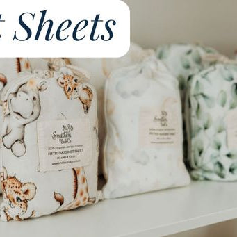 Cot sheets in their bags lined up on a shelf