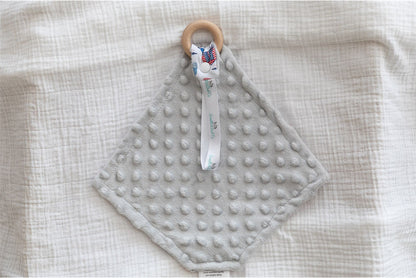grey Minky dot polar fleece fabric on the back of baby comforter