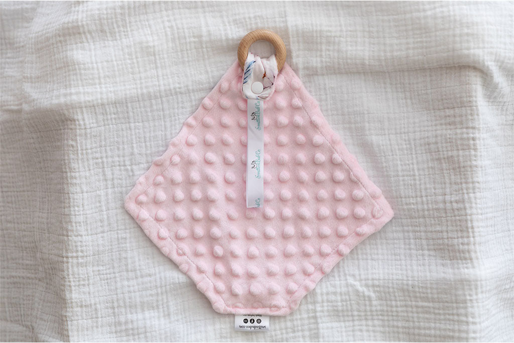Pink Minky dot polar fleece fabric on the back of baby comforter
