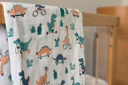 Bamboo Muslin and Organic cotton swaddle wrap Dinosaurs on bikes and skateboards print