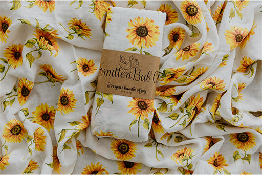 Bamboo Cotton Muslin Wrap Swaddle printed with bright yellow sunflowers.